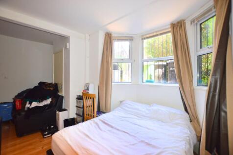 Bright double bedroom featuring a large bay win...