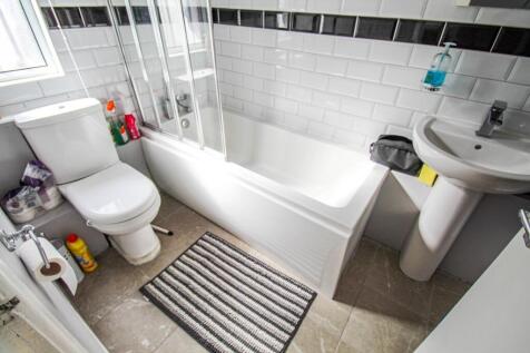 Bright and clean bathroom featuring a modern wh...