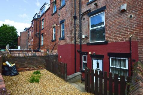 A well-maintained brick terraced house exterior...