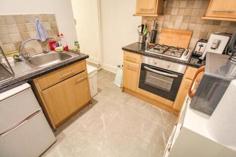 A compact and functional kitchen featuring mode...