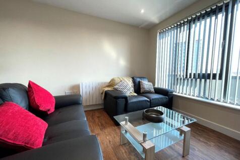 A bright and spacious modern living room, perfe...