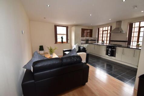 Spacious and modern open-plan living area featu...