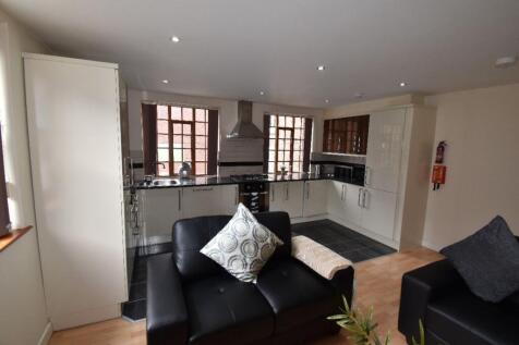 Bright and modern living room with a cozy seati...