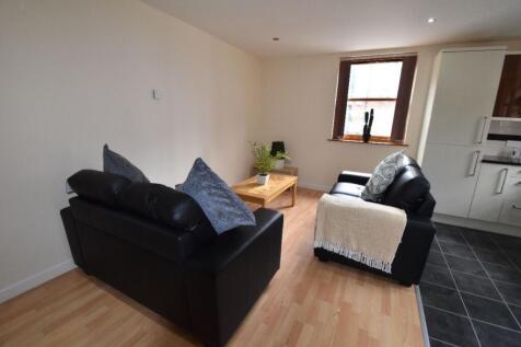 A cozy, well-maintained living room featuring c...