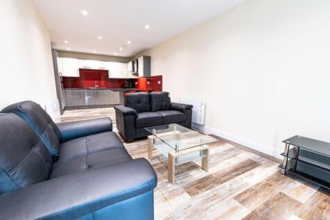 A bright and modern living room featuring comfo...