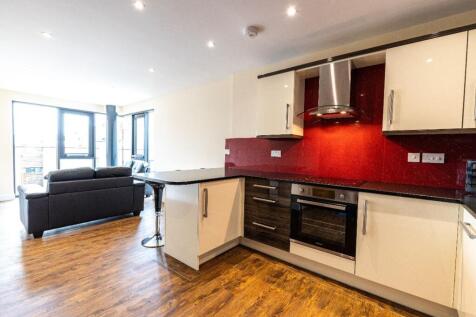 A modern and spacious kitchenette with sleek de...