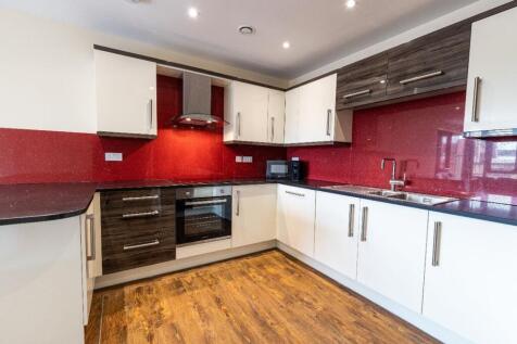A modern and stylish kitchen with sleek cabinet...