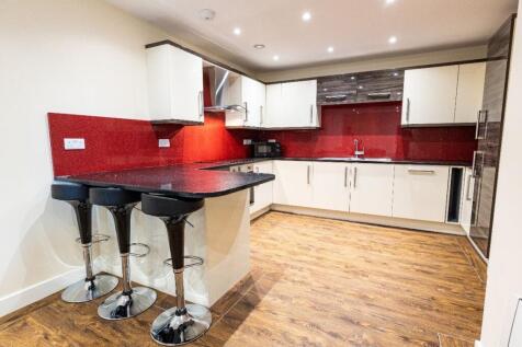 Modern kitchen with ample counter space, featur...