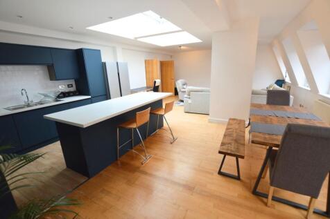 Spacious and modern open-plan living area featu...