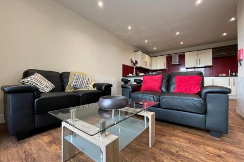 A modern and cozy living room featuring two bla...