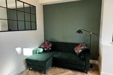 Cozy living room corner featuring a stylish dar...