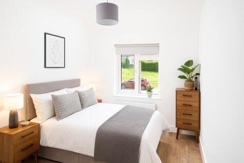 A bright and neatly presented double bedroom fe...
