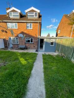 Bright and inviting rear view of a spacious ter...