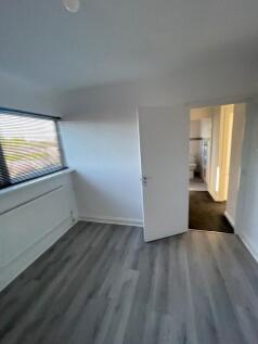 A clean and well-maintained room featuring mode...