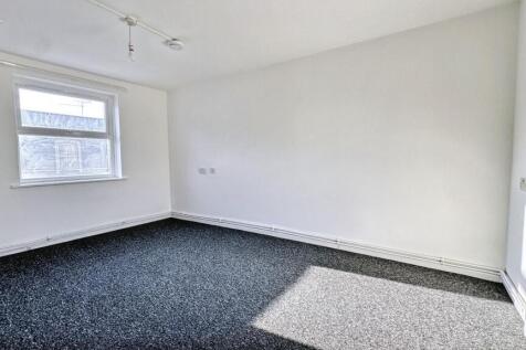 Bright and fresh double bedroom featuring clean...
