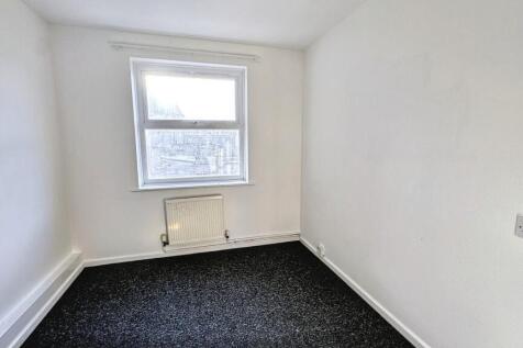 Bright and clean small room with a window and r...