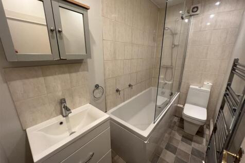 A well-maintained, modern bathroom featuring a ...