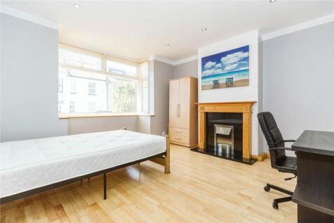 Bright and spacious master bedroom featuring a ...
