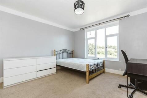 A bright and well-kept double bedroom featuring...