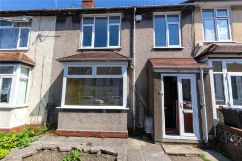 A well-maintained terraced house with a clean p...