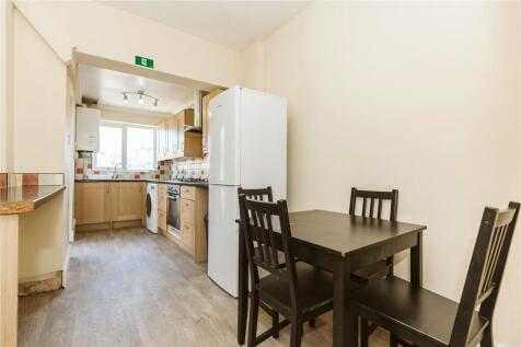 A bright and functional kitchen featuring a din...