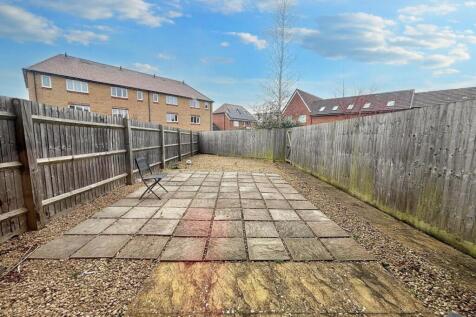 A spacious garden area featuring a well-maintai...