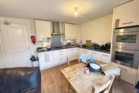 Spacious kitchen featuring modern appliances, a...