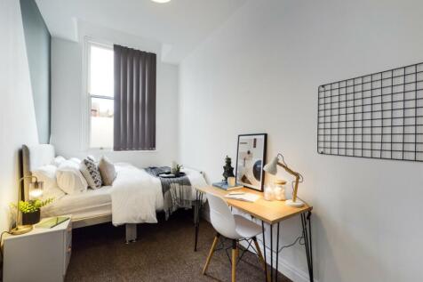 A bright and inviting double bedroom featuring ...