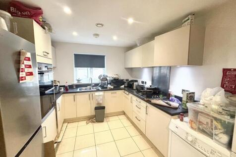 This modern kitchen features ample counter spac...
