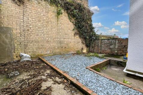 A bright and sunny garden area featuring a neat...