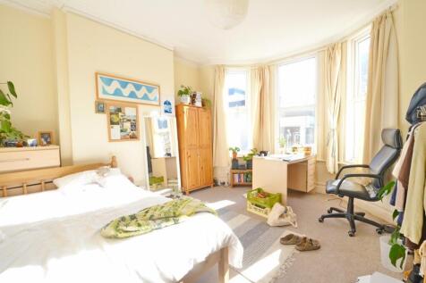 Bright and spacious master bedroom featuring a ...