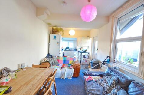 Bright and inviting living room featuring a lar...