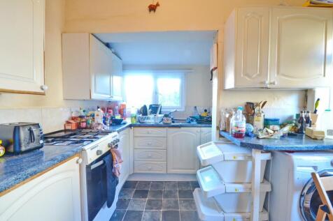 Bright and practical kitchen featuring ample co...