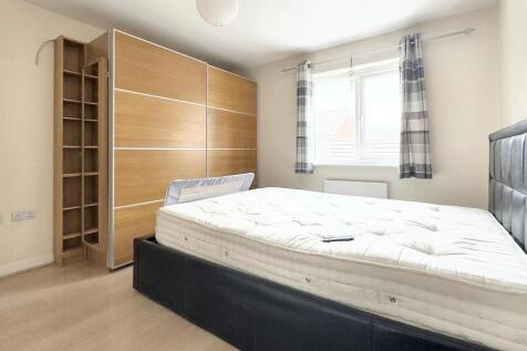 Bright and tidy double bedroom featuring a larg...