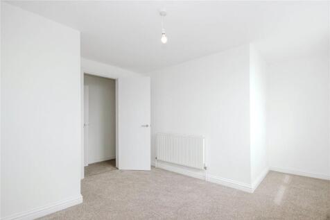 Bright double bedroom with fresh white walls an...