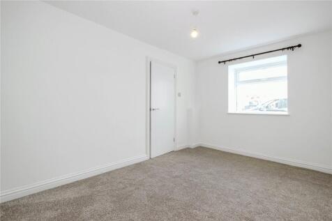 Bright and clean double bedroom featuring neutr...