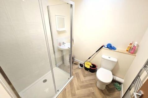 Bright and clean bathroom featuring a modern wa...