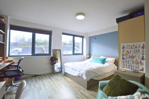 Bright and spacious master bedroom featuring a ...