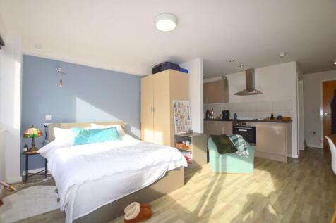 Bright and inviting master bedroom with a cozy ...