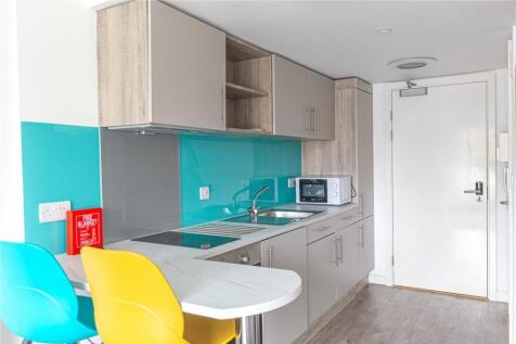 Modern and clean kitchen area featuring contemp...