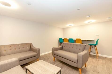 A modern communal lounge featuring comfortable ...
