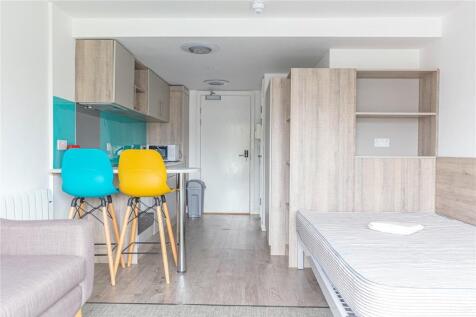 A modern and bright studio apartment featuring ...
