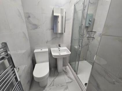 Bright and modern bathroom featuring a sleek wa...