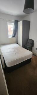 Cozy single bedroom with a comfortable mattress...