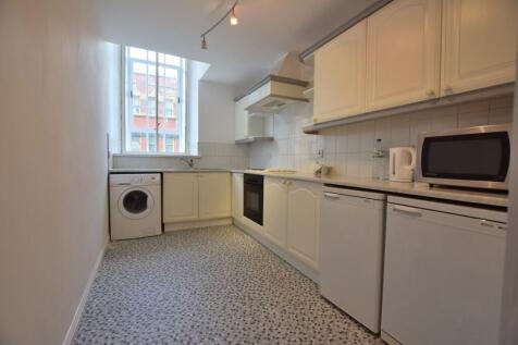 Bright kitchen with an efficient layout featuri...