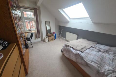 A bright and inviting double bedroom featuring ...
