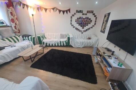 A cozy and inviting living room featuring multi...