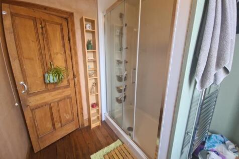 A bright and well-maintained bathroom suite fea...