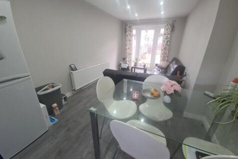 Bright and modern kitchen area featuring a glas...