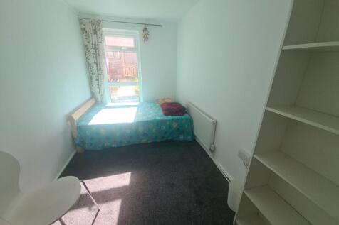 A neat and bright single bedroom featuring a co...